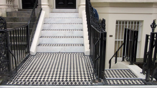 Steps - A Georgian town house entrance is enhanced with the addition of black and white checker board tiles along with marble step risers.